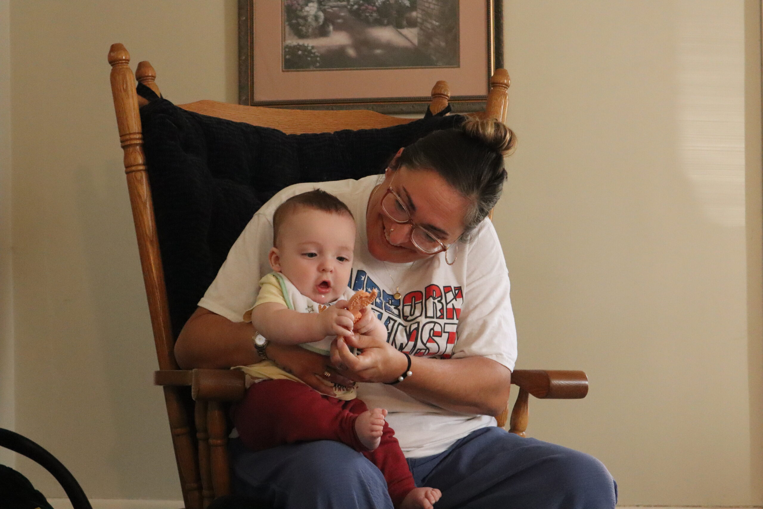 Mother holding her child while in PNP's program.